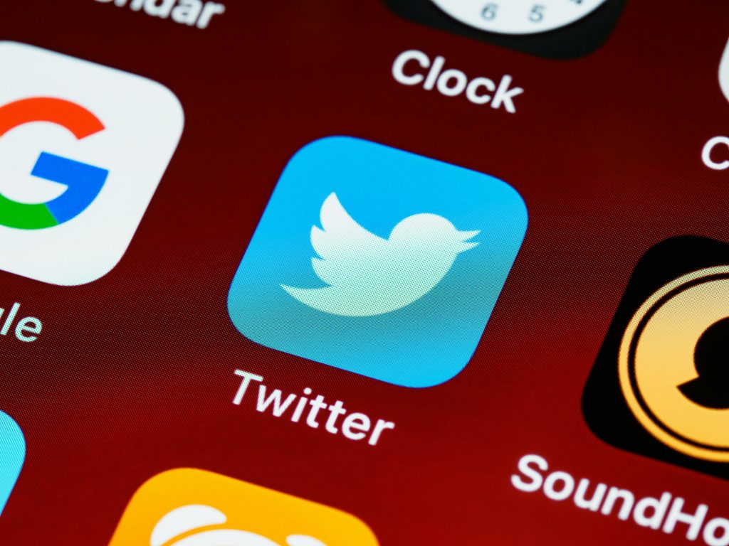 Social Media advertising Detailed close-up image of popular social media icons on a smartphone screen.